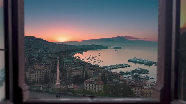 naples skyline time lapse at sunrise seen through window