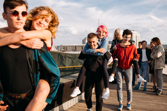 Young hipster gang. Bff have fun hanging out together. Carefree mischievous teenage friends. Students on holidays