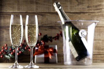 two champagne glasses with champagne bottle and ice bucket I