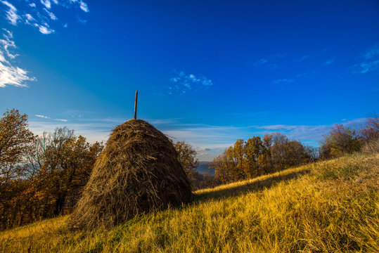 stack of hay sun and sky lendscape