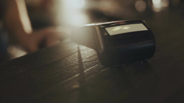 Using terminal machine for paying. 4K