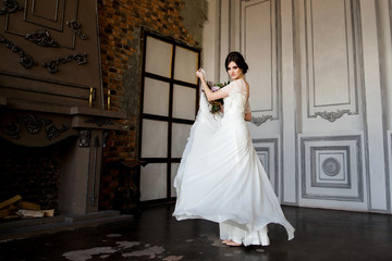 Beautiful Bride Portrait. Beautiful bride whirls her wedding dress.