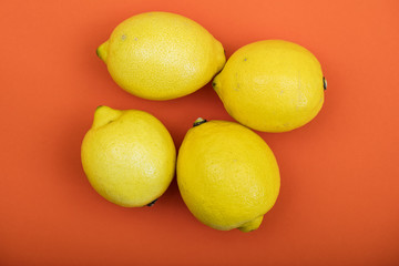 lemons on orange background 