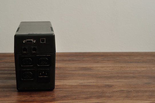 The back of a black uninterpretable power supply for a computer