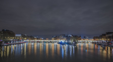 river in Paris at night, light reflections