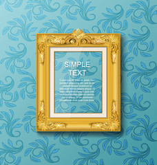 Gold vintage picture frame on blue wall
