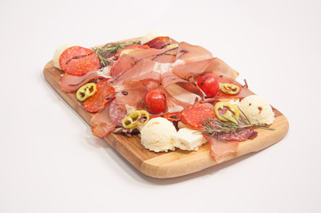 Cold smoked meat on wooden board
