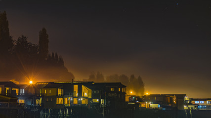 Night Scene Palafito Houses at Lake, Chiloe, Chile