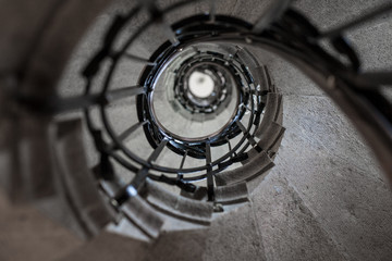 Vintage upward stone spiral stairway