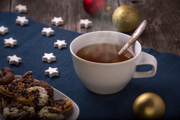 christmas tea, wooden and fabric background,horizontal