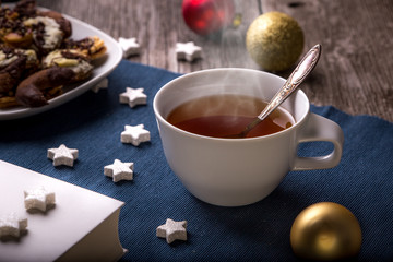 christmas tea, wooden and fabric background,horizontal