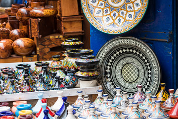 Plates, tajines and pots made of clay on the souk in Marocco.