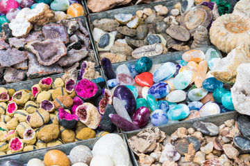 Selection of colorful minerals on a traditional Moroccan market (souk) in Marrakech, Morocco