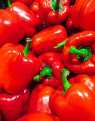 A whole box of red, fresh, juicy peppe