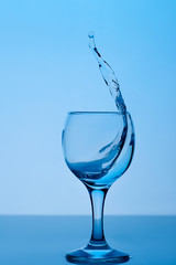 glass of water on a dark blue background