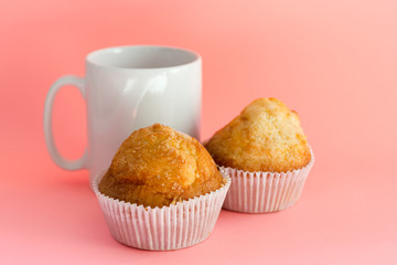 Muffins and mug. Homemade pastries, sweet cupcakes for breakfast