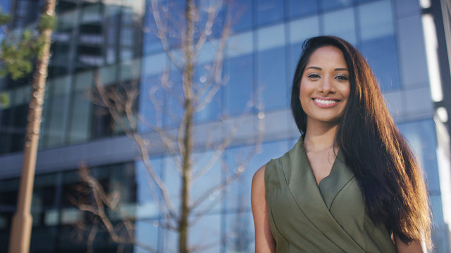 Portrait of attractive female professional outside office building