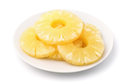 Canned pineapple slices on plate