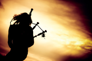 Man Playing The Bagpipe