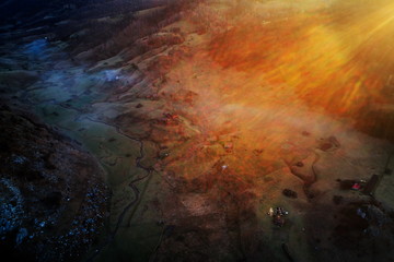 aerial view of mountain landscape with autumn morning fog at sunrise - Romania