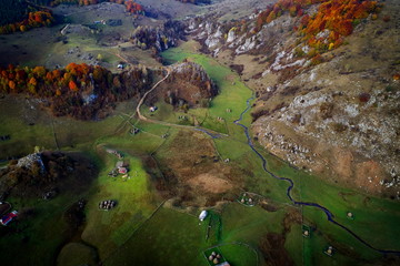 aerial view of mountain landscape with autumn morning fog at sunrise - Romania