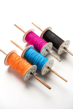 Fikri /Reel/Chakri /Spool with colourful thread or manjha or manja for Kite flying in Indian festival called Makar Sankranti which is uttarayan or uttarayana
