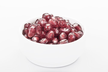 pomegranate seeds on white background
