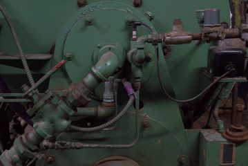 Old Boiler room in dirty old basement of warehouse building with rust and trash
