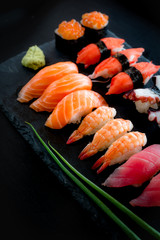 Set of Sushi & Sasimi on black stone plate
