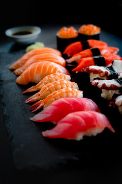 Set of Sushi & Sasimi on black stone plate