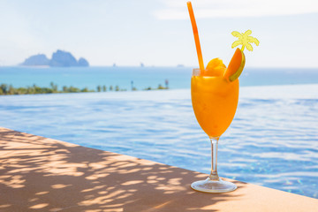 Tasty Mango Juice In Glass At Poolside