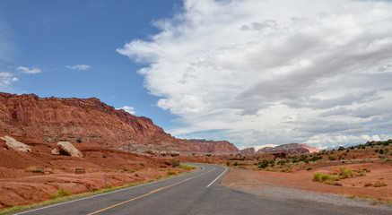 Fototapeta na wymiar Utah State Route 24 passing Twin Rocks near Capitol Reef National Park 