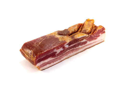 Block of bacon smoked pork with its meat and fat lines on a white background
