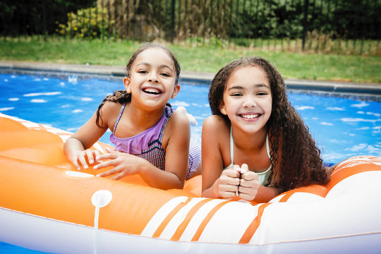 Two girls in swimming pool 