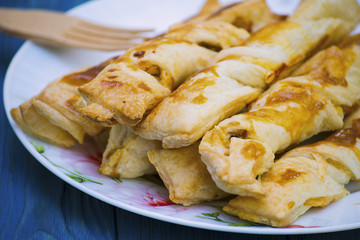 Sticks of puff pastry with ham and cheese