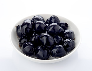 black olives in bowl isolated on white