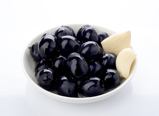 black olives in bowl isolated on white