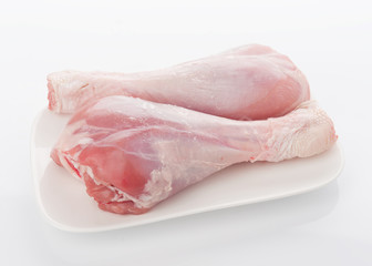 skinless turkey drumsticks isolated on white