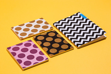 The many notebooks on colored table. memo and planning concept.