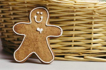 Human shape gingerbread cookie close up on a basket