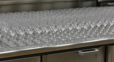 Rows of empty wine glasses on the showcase