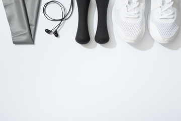 Fitness flat lay, unisex sports equipment on white background