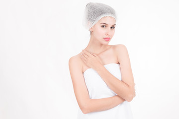 Portrait of plastic surgery patient. Portrait of plastic surgery patient, beautiful white female with head cap, white towel, isolated in white. Ready for plastic surgery operation.