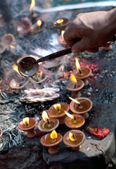 Offering candles at Dakshinkali Hindu Temple in Pharping, Nepal