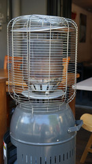 Empty cafe gas heater at midday