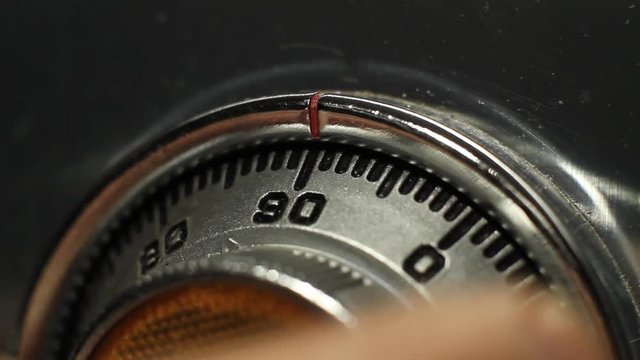 Close up of a man opening a safe