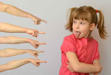 many hands pointing fingers at the child, kid of a rebel conceptual photography