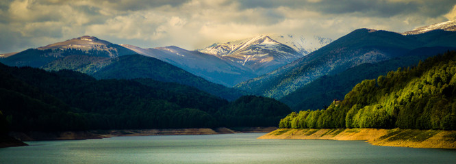 Panoramic view over Fagaras Mountains and Vidraru Lake