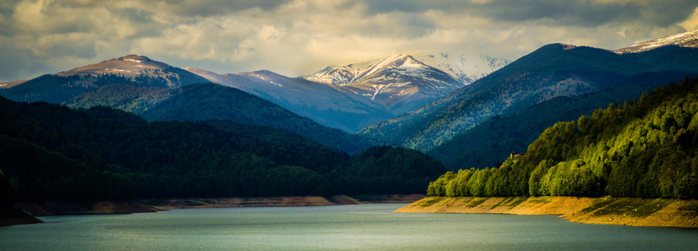Panoramic view over Fagaras Mountains and Vidraru Lake