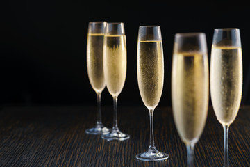 Cold sparkling wine, close up. Black background.